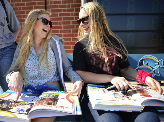 Seniors reminisce about the past year and sign each other's yearbooks.