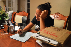 Ruth Nguyen ('17) tries to plan for Valentine's Day among her schoolwork. Photo by Christine Cao